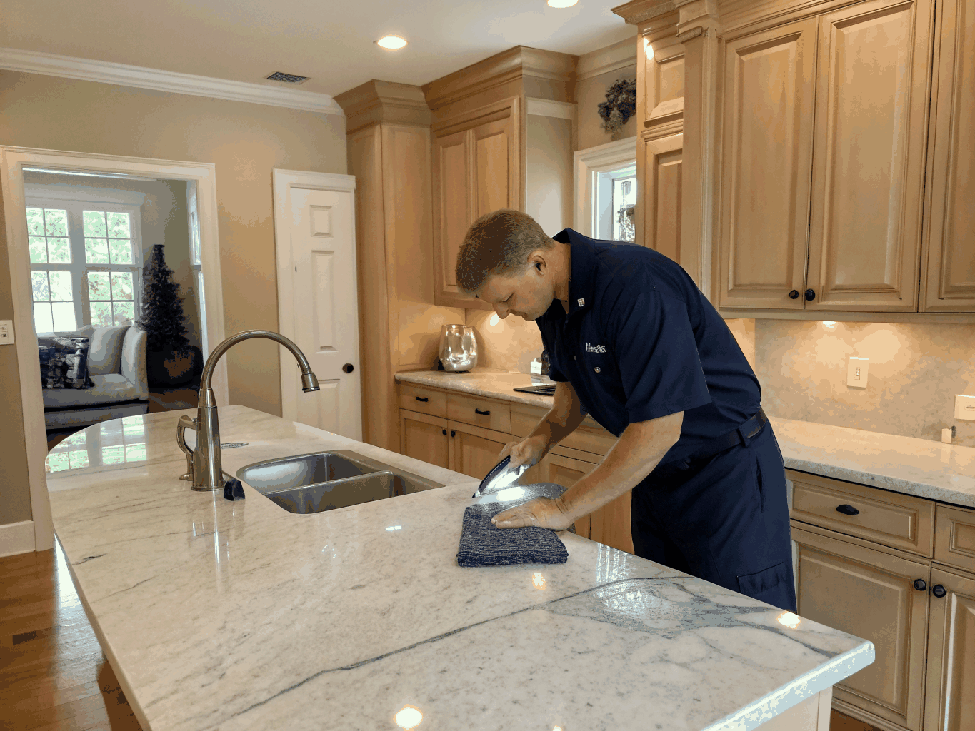 Gleaming polished kitchen sink and sanitized countertop